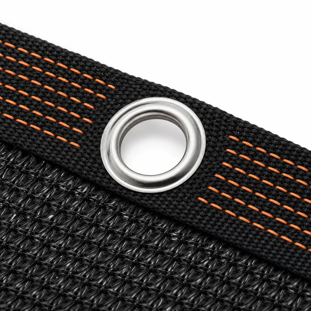 Close-up of a metal grommet set into the stitched bound edge of the shade cloth